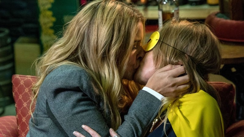 Charity and Vanessa share a passionate kiss