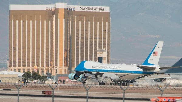 Air Force One with US President Donald Trump lands in Las Vegas with the Mandalay Bay resort in the background