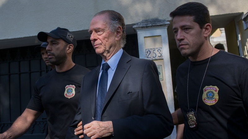 Brazil's Olympic Committee chief Carlos Nuzman (centre) is escorted from his home by federal police in Rio de Janeiro