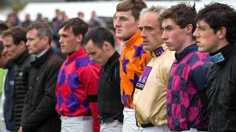 Ruby Walsh stands with fellow jockeys for a minutes silence in memory of JT McNamara at the 2015 Galway Festival
