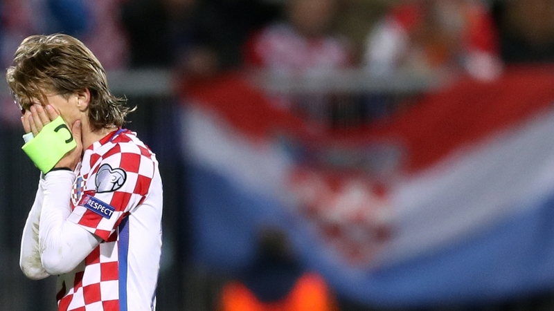 Croatia captain Luka Modric holds his head in his hands after Finland's late equaliser