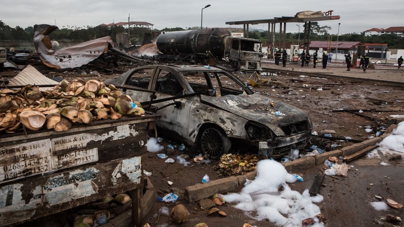 Scattered fruit and broken coconuts from street vendors were strewn near the wreckage next to burnt-out cars and a fuel lorry