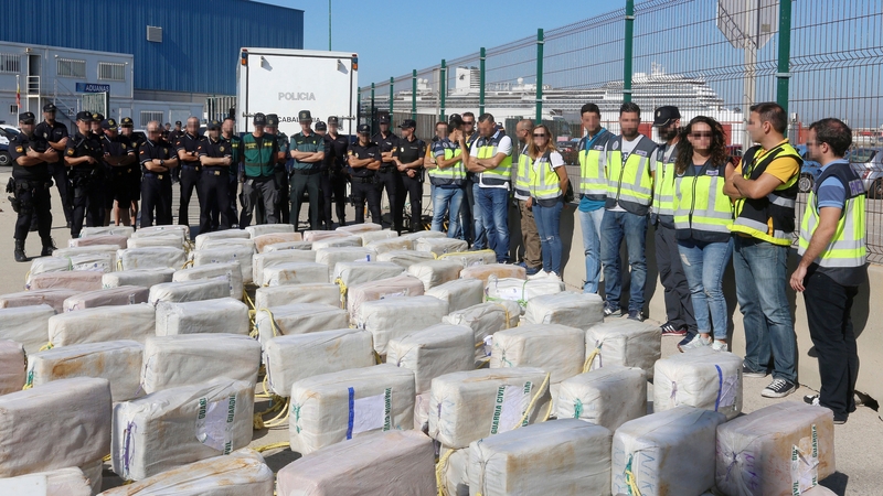 Spanish police pose next to the cocaine seized off the coast of the Canary Islands