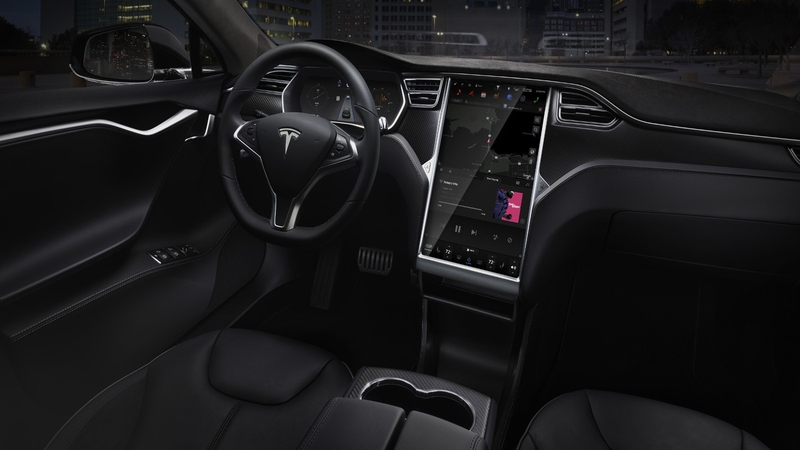 Tesla's huge infotainment screen is a class-leader. But how many functions should be available when driving ?
