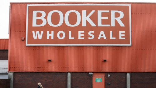 Charles Wilson, the executive director who leads Tesco's Booker wholesale business, will retire next year