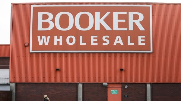 Charles Wilson, the executive director who leads Tesco's Booker wholesale business, will retire next year