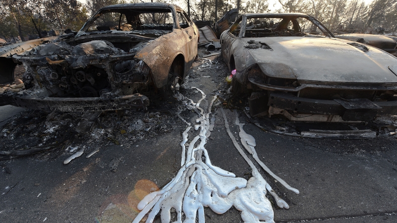 Melted metal from burnt cars seen on the ground after wildfires ripped through Santa Rosa