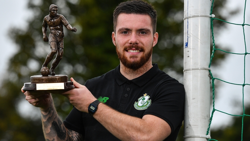 Brandon Miele with his award