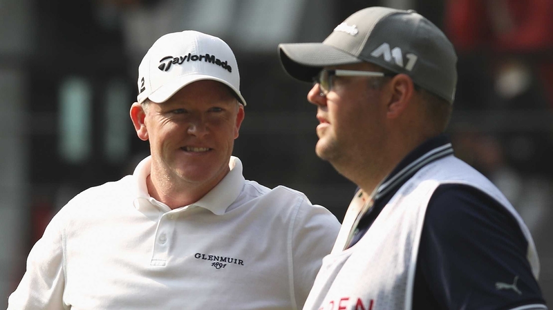 Marcus Fraser smiles with his caddie Jason Wallis