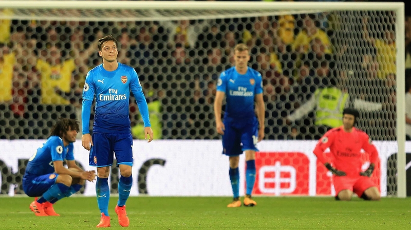 Arsenal players dejected after conceding a late winner at Watford
