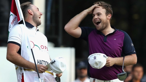 Tyrrell Hatton (R) celebrates his victory