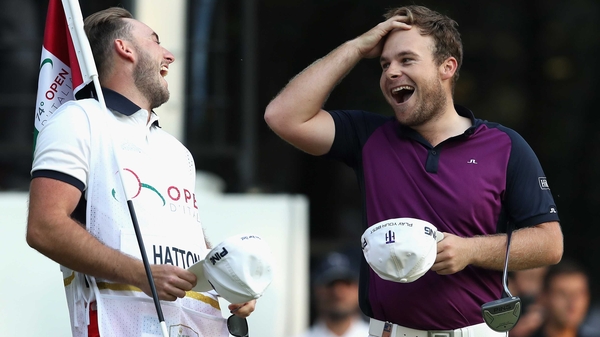 Tyrrell Hatton (R) celebrates his victory