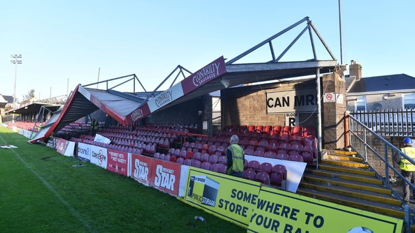Workmen survey the damage to the roof of Turners Cross stadium in Cork