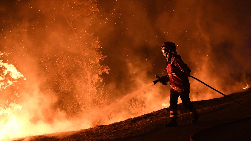 Firefighters battled strong winds, dry land and high temperatures