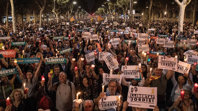 Around 200,000 people have taken to the streets of Barcelona for a candle-lit protest