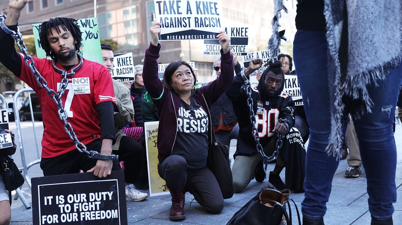 Protesters outside the NFL meeting in New York