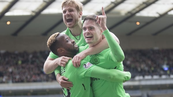 Moussa Dembele (L) celebrates his goal, Celtic's third, with Michael Lustig and Stuart Armstrong