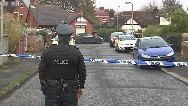 The woman was discovered injured in the back garden of a home, police said