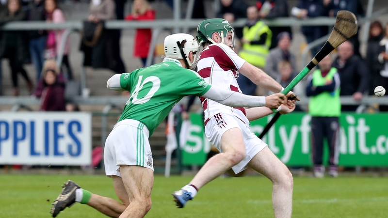 Ballygalget's John McManus with Gerard Bradley of Slaughtneil (r)