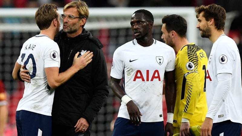 Jurgen Klopp hugs Harry Kane, who scored twice against Liverpool