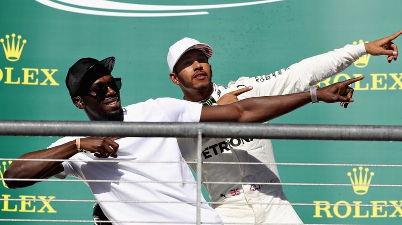 Lewis Hamilton celebrates with Usain Bolt