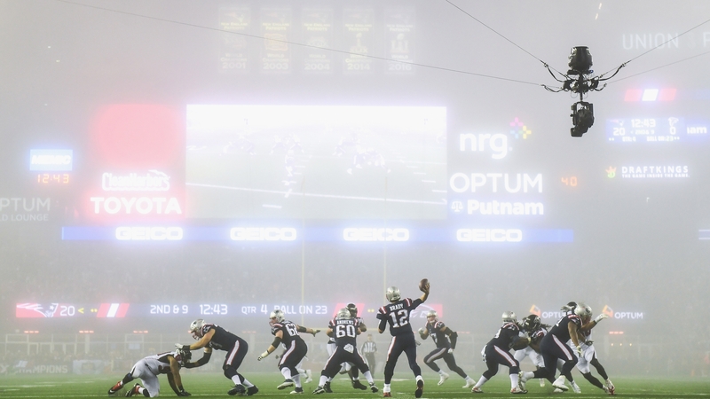 Tom Brady of the New England Patriots throws as fog falls on the field during the fourth quarter against the Atlanta Falcons at Gillette Stadium