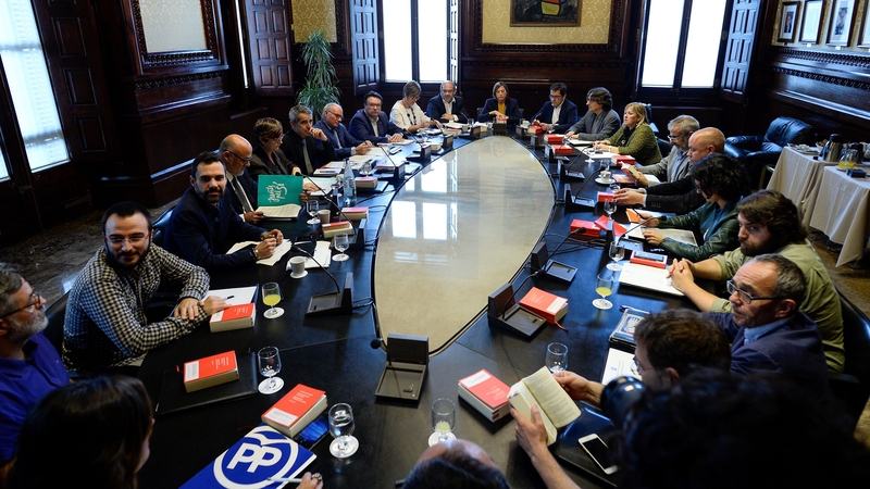 President of the Catalan parliament Carme Forcadell (centre) attends a meeting with parliament representatives at the Catalan Parliament in Barcelona