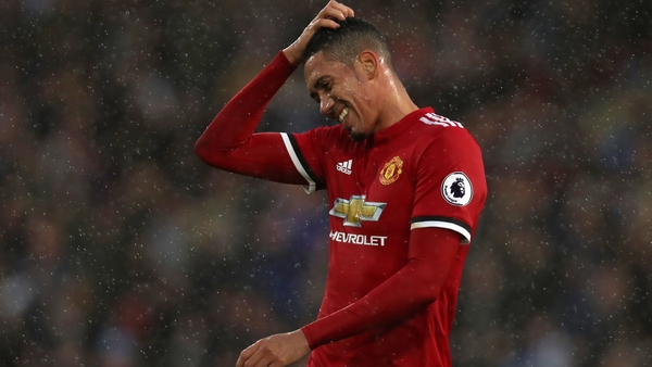 Chris Smalling cut a dejected figure following the surprise Premier League defeat to Huddersfield