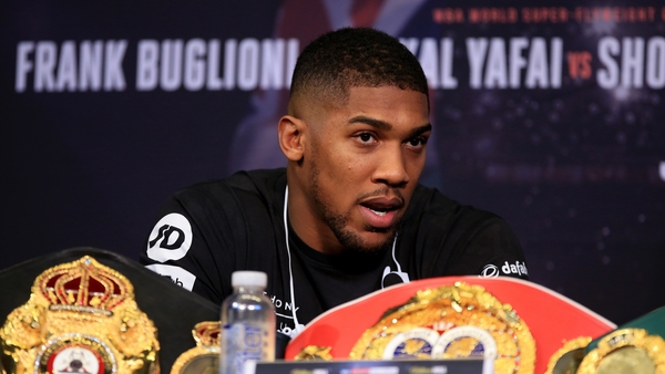 Former Olympic champion Anthony Joshua squared up to Jarrell Miller during his meet with Alexander Povetkin after the American invaded the stage.