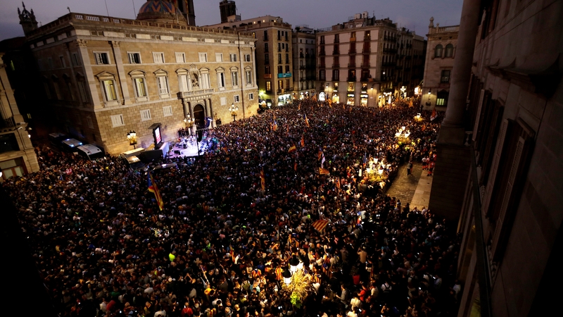 People celebrate after the declaration of independence at Catalan Assembly, at Sant Jaume square in Barcelona