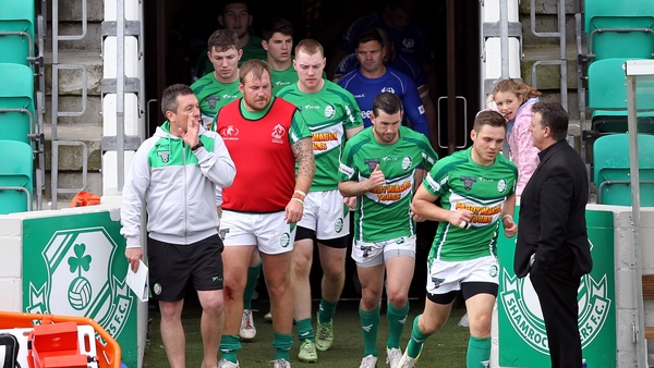 Head coach Mark Aston leads his players out onto the field