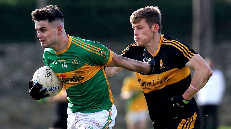 Clonmel's Michael Quinlivan (L) evades Gavin White of Dr Crokes