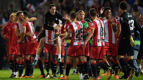 Girona players celebrate a memorable win