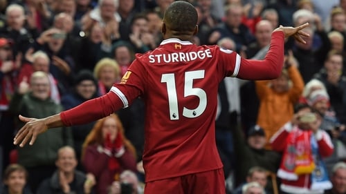 Daniel Sturridge celebrates his well-taken goal against Huddersfield Town at Anfield