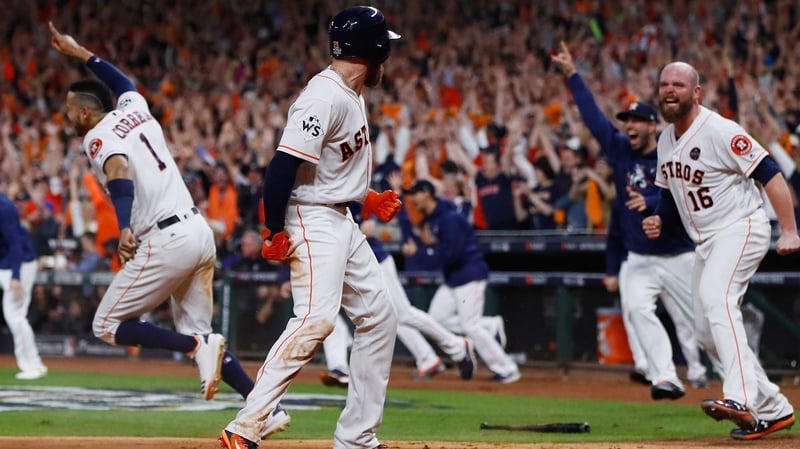 Derek Fisher of the Houston Astros celebrates with Brian McCann