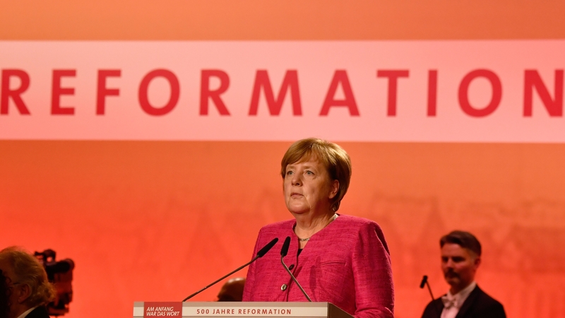 Angela Merkel speaking at a ceremony in Wittenberg, scene of the first move of the Reformation