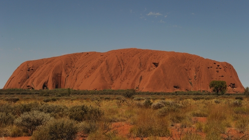 The UNESCO World Heritage-listed 348m high rock, known for its shifting red-ochre colours, is a top tourist site