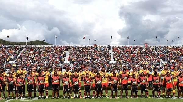 Papua New Guinea embrace for their national anthem