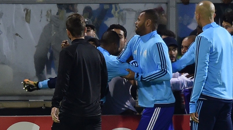 Video footage showed Evra aiming a kick at a group of fans