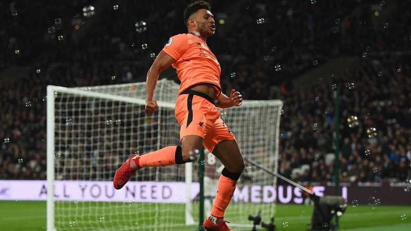 Alex Oxlade-Chamberlain runs to the Liverpool fans after his goal