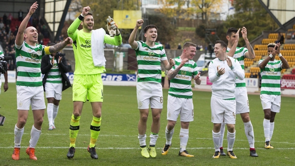 Celtic players celebrate breaking the record