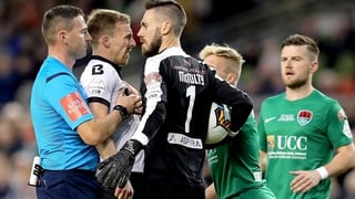 Dundalk's David McMillan clashes with Mark McNulty of Cork City