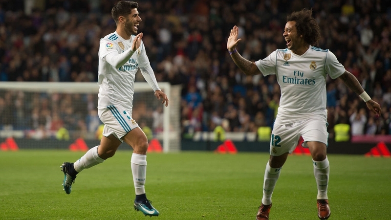 Marco Asensio (L) celebrates with his team-mate Marcelo