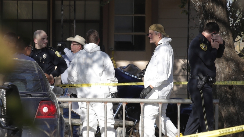 Law enforcement and forensic officials outside the church following the shooting