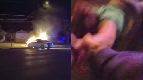 Watch as hero police officer pulls a woman from a burning car