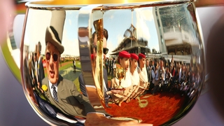 Owner Lloyd Williams (L) and trainer Joseph O'Brien (C) are reflected in the Melbourne Cup