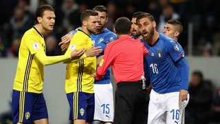 Things get hot and heavy during Sweden's play-off first-leg clash with Italy