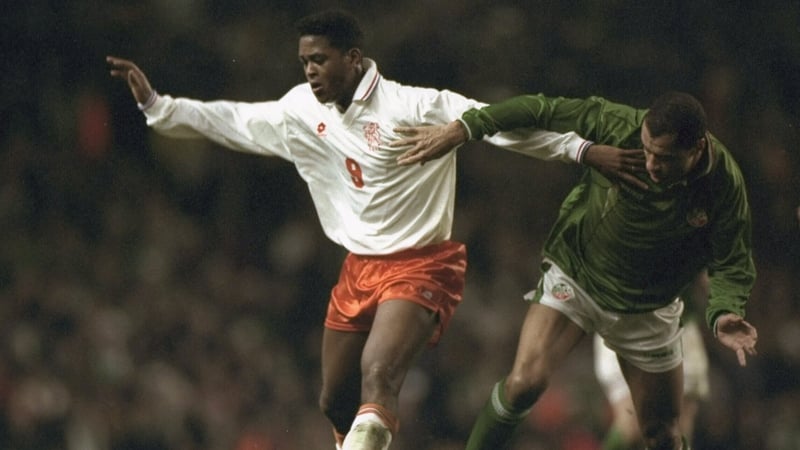 Patrick Kluivert and Paul McGrath battle for possession in the Euro 96 play-off