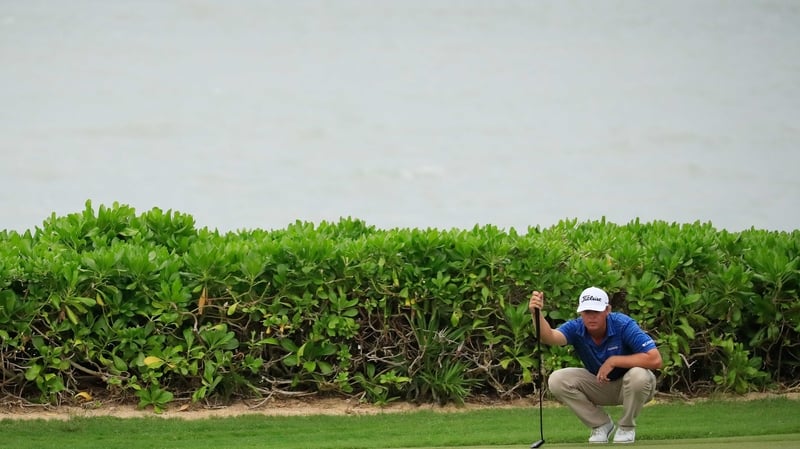 Patton Kizzire of the United States lines up a putt on the 15th green