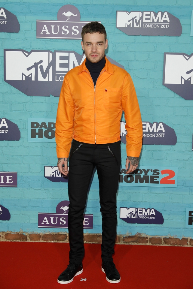 Liam Payne kept it casual before his EMA performance in black jeans and an orange jacket.